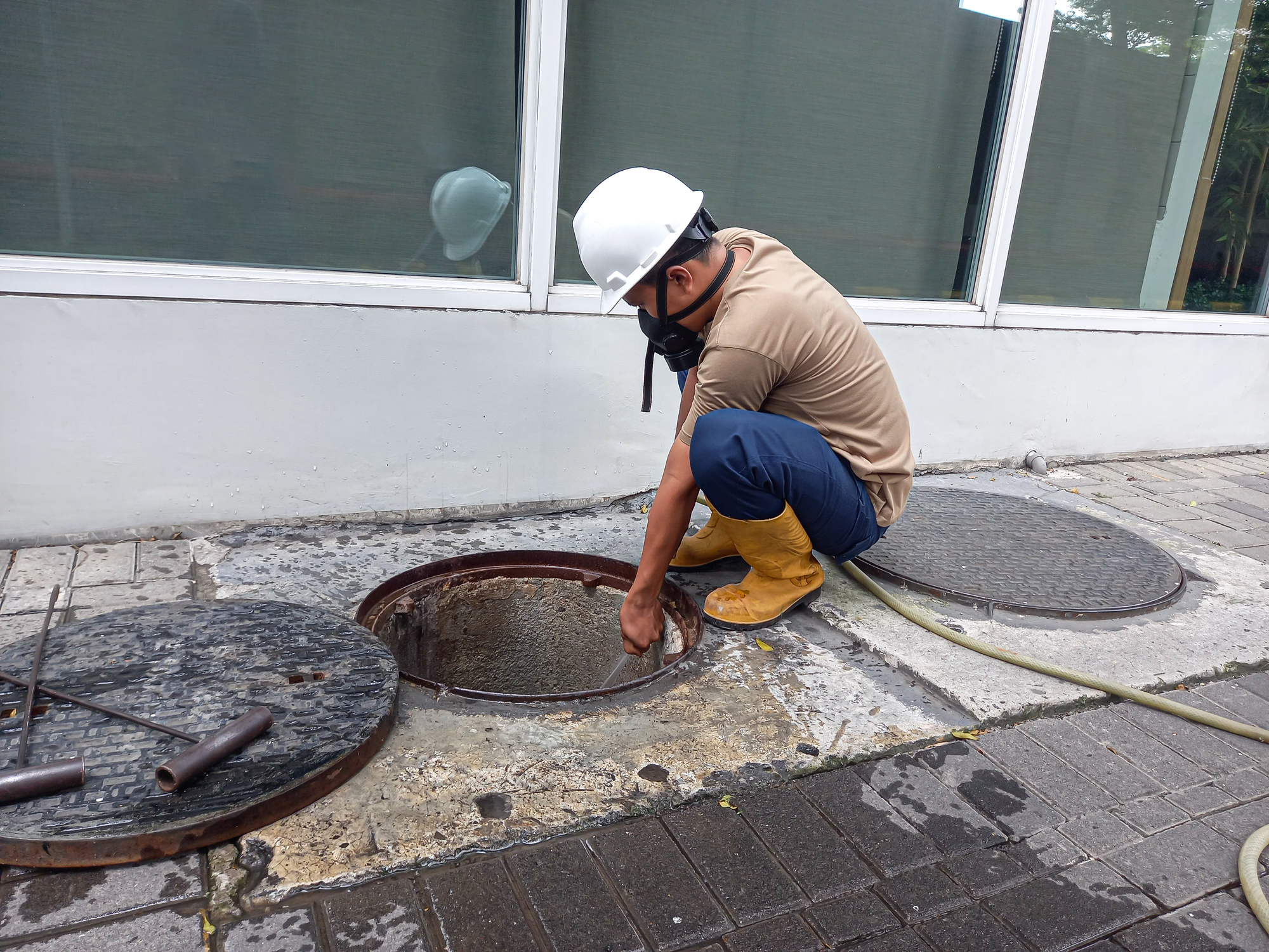 A septic tank being pumped by a professional technician