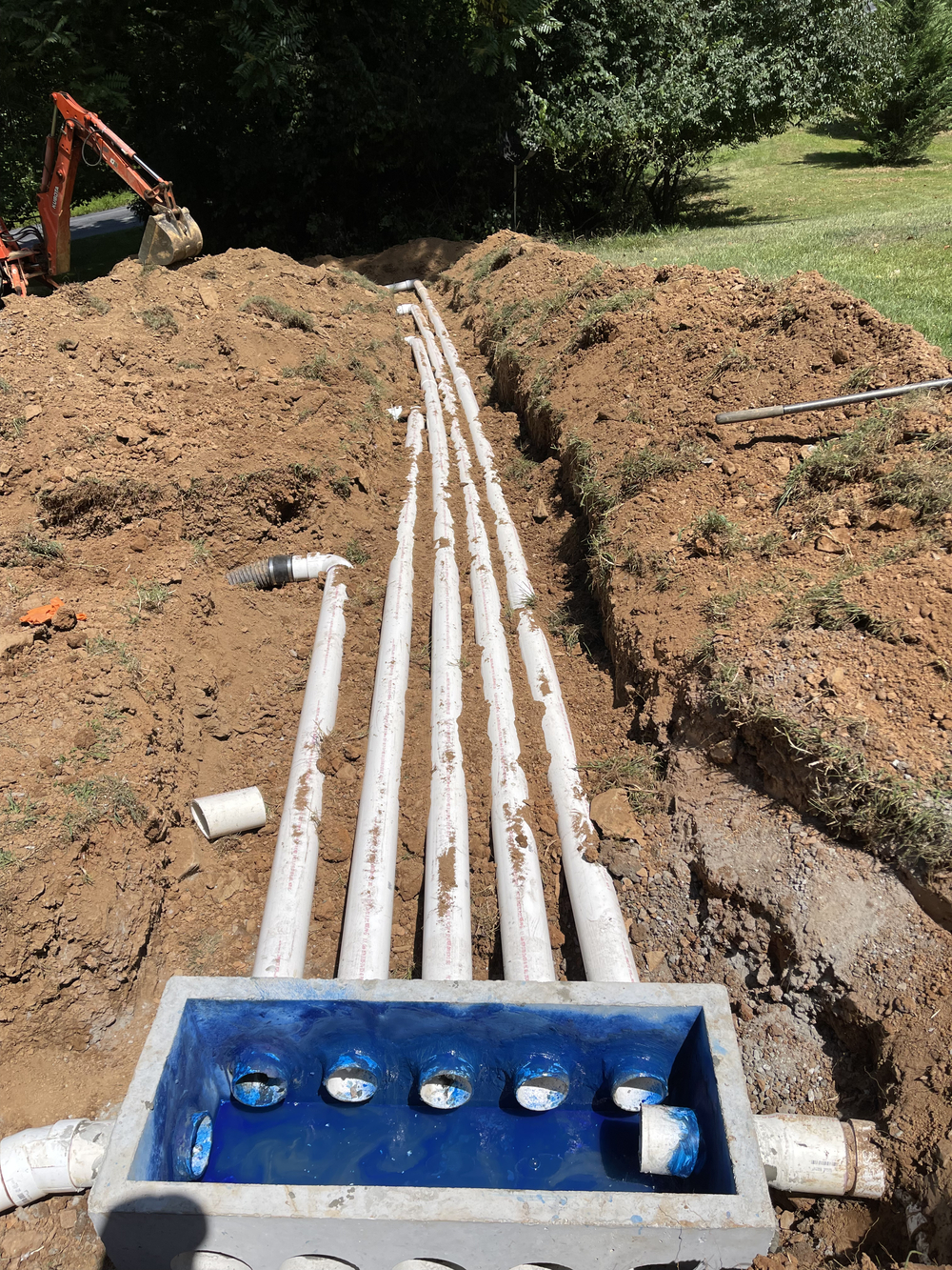 Professionally installed septic system with neat landscaping and minimal disruption